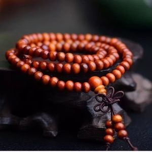 TIBETAN ORANGE SANDALWOOD MALA BRACELET